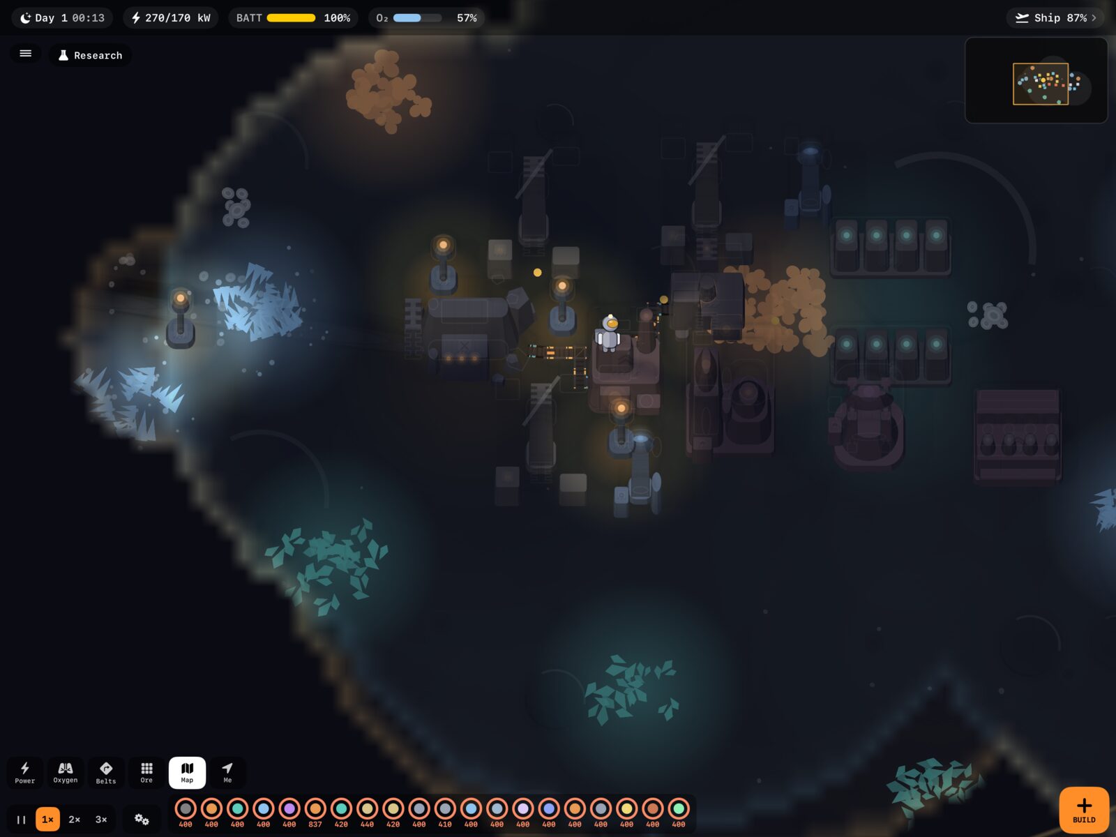 A lunar base at night, its machines and belts lit by base lights against the dark
